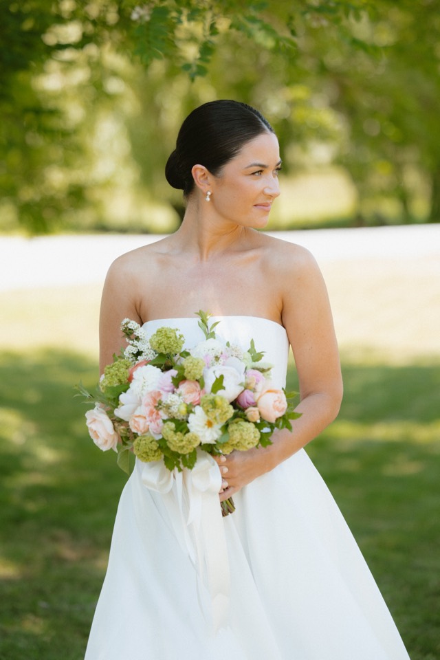 Bride with bouquet in evening light